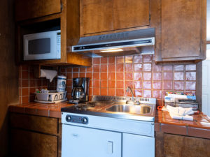 Studio Unit kitchenette with microwave, dishwasher, sink and stove