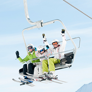 three people on a ski lift
