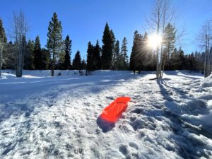 Red sled on sledding hill in Tahoe