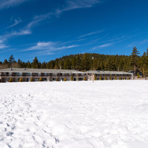 Tahoe Sands Resort property welcome sign with snow
