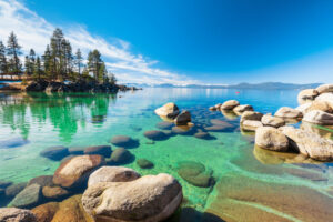 Lake Tahoe shoreline with rocks and trees