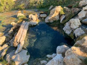 Hot spring surrounded by rocks