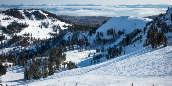 Palisades Tahoe ski resort with cloudy Lake Tahoe in background