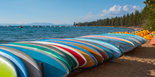 group of paddleboards on beach on Lake Tahoe